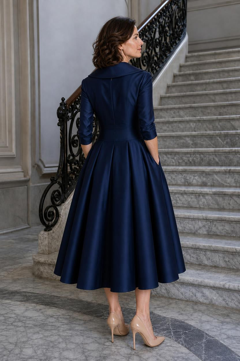 Vestido midi Marley Quinn visto de espaldas, con la cremallera invisible y las tablas de la falda