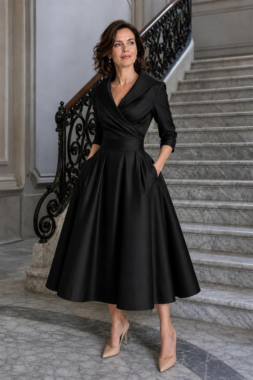 Vestido midi Marley Quinn en negro, con cuello de solapa y falda de tablas con vuelo